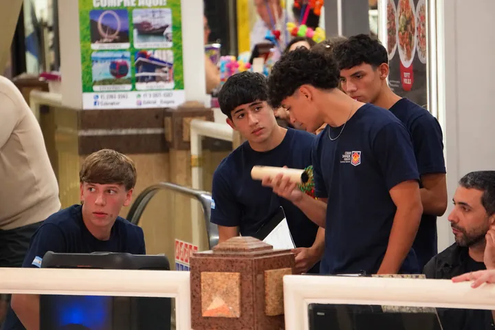 Percussion accompanies the group’s singing.